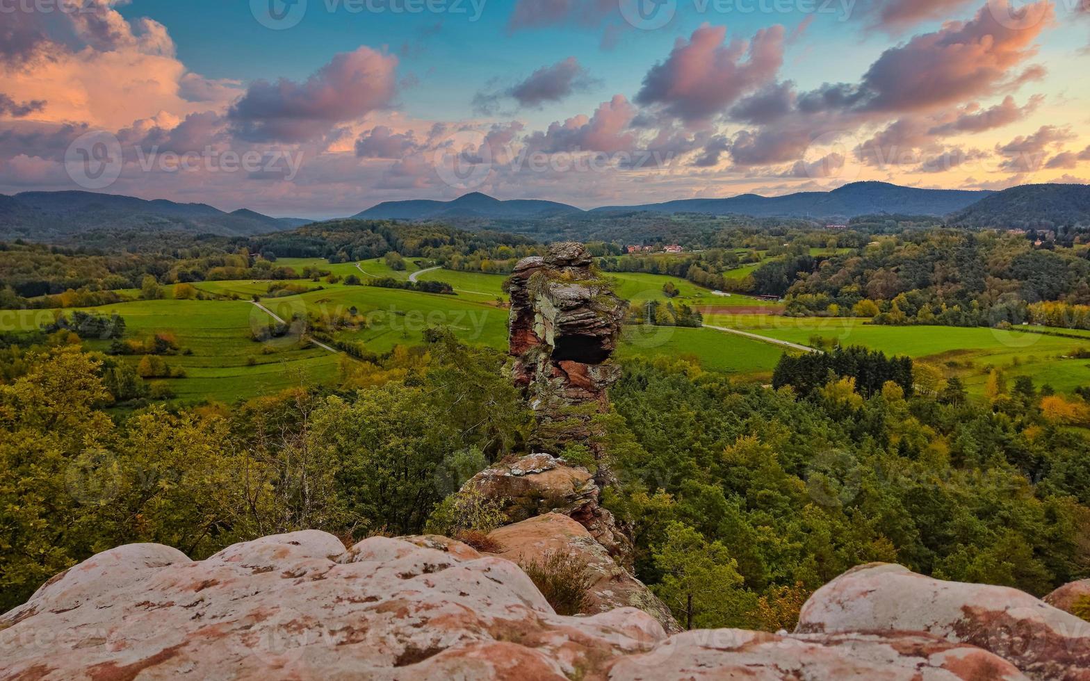 Interesting colored sandstone formations with nice view on the forest photo