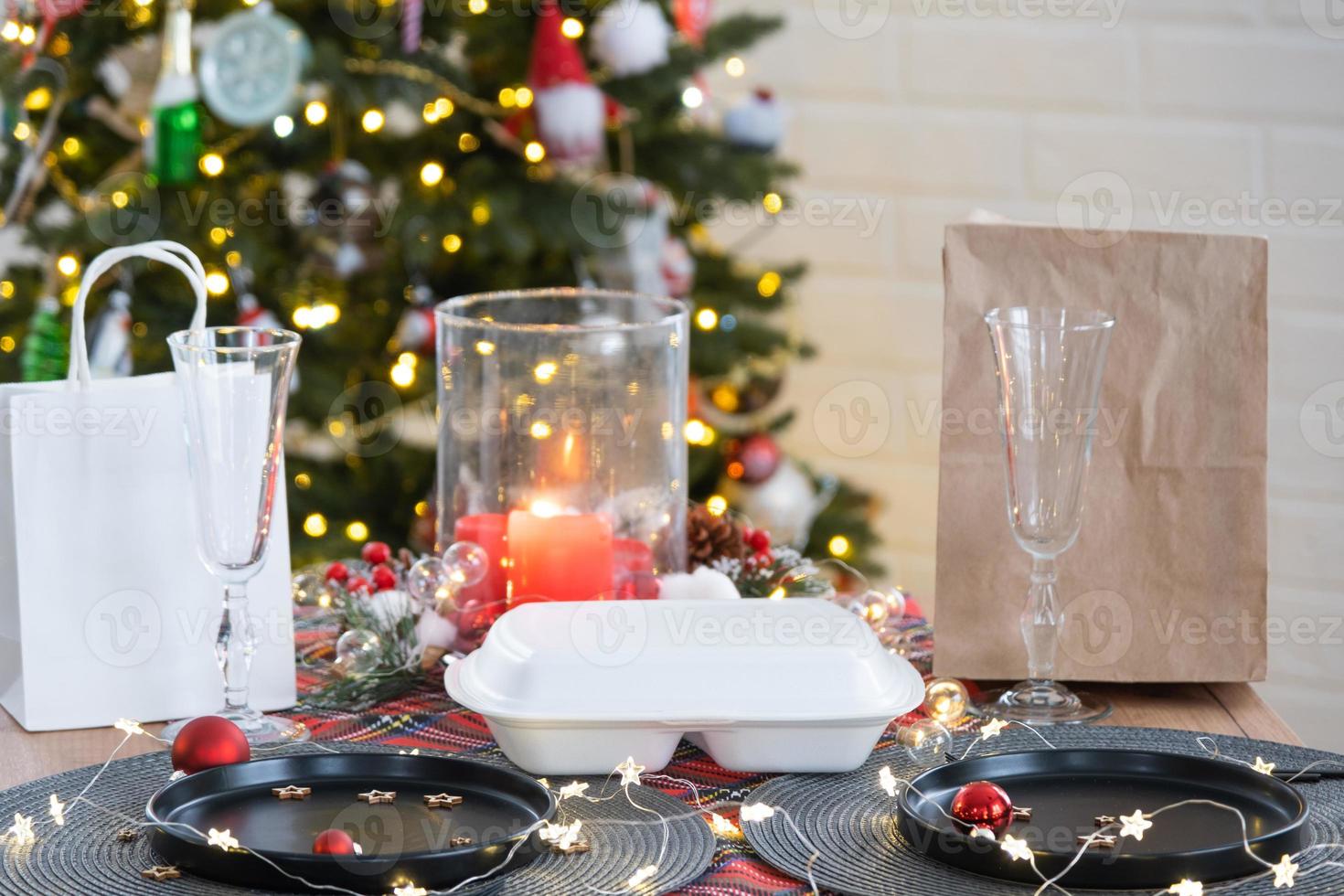 Food delivery service containers on table, festively served for the celebration of Christmas and new year. Tableware and loft-style decor. Saving time, hot order, disposable plastic box. mock up photo