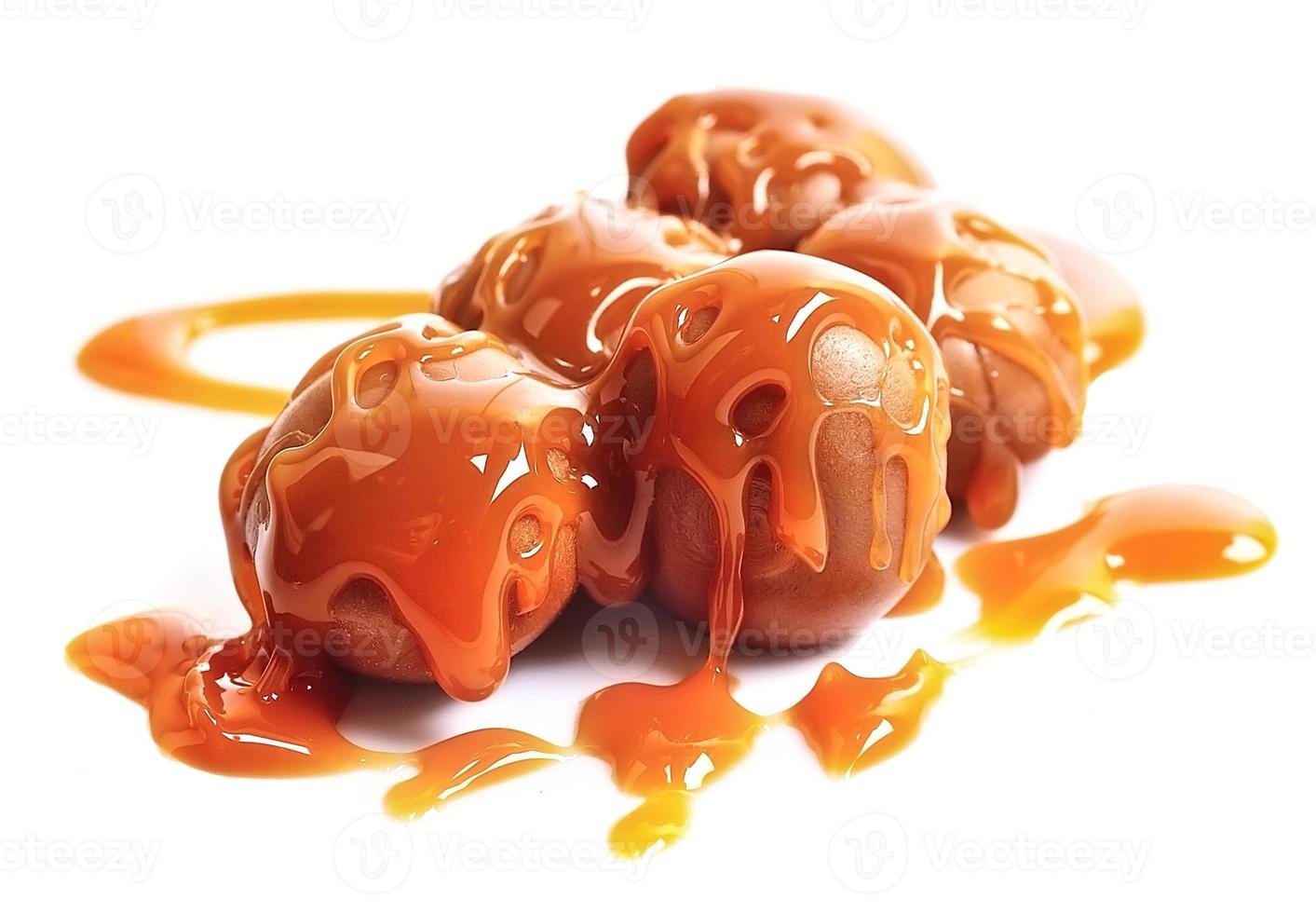 Caramel candies and caramel topping photo