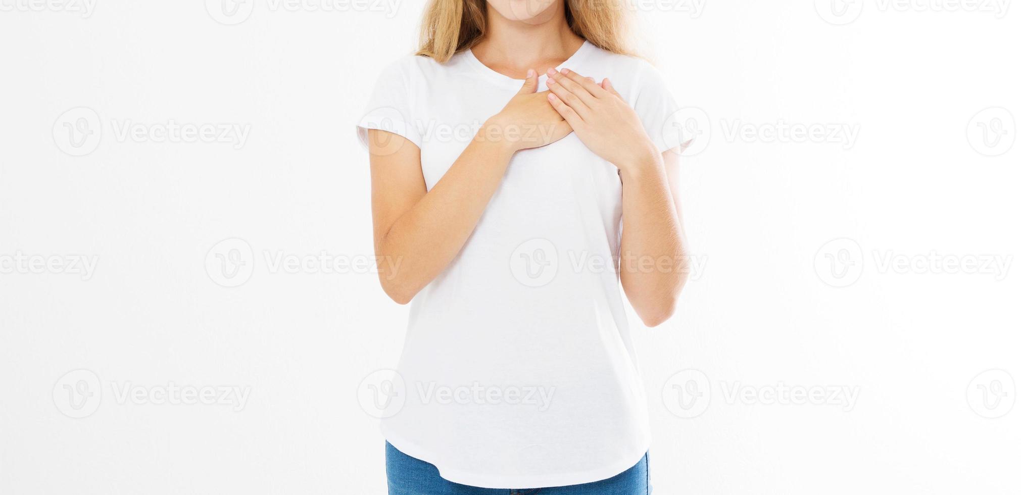 Banner Girl touching her heart. Healthy life style living. Love romance and body language. Smiling happy woman face and template white t shirt with copy space isolated on white background. Summer time photo