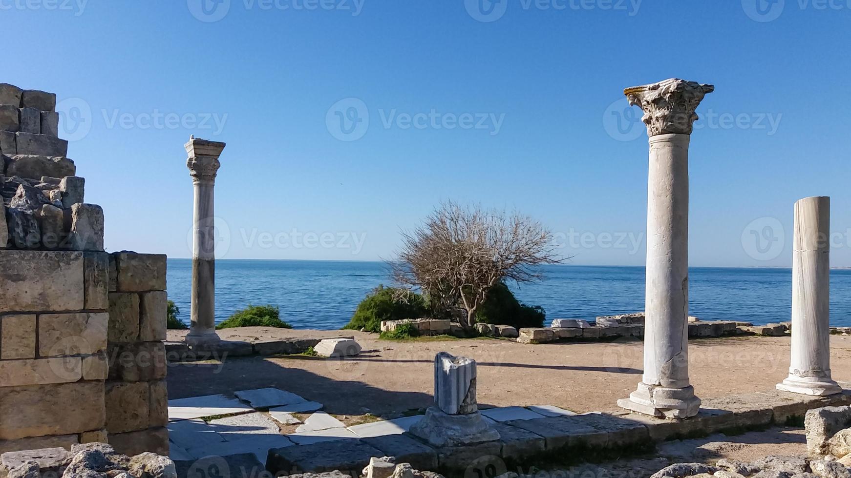 Ancient Doric columns on the seashore in Crimea, Tauric Chersonesos photo