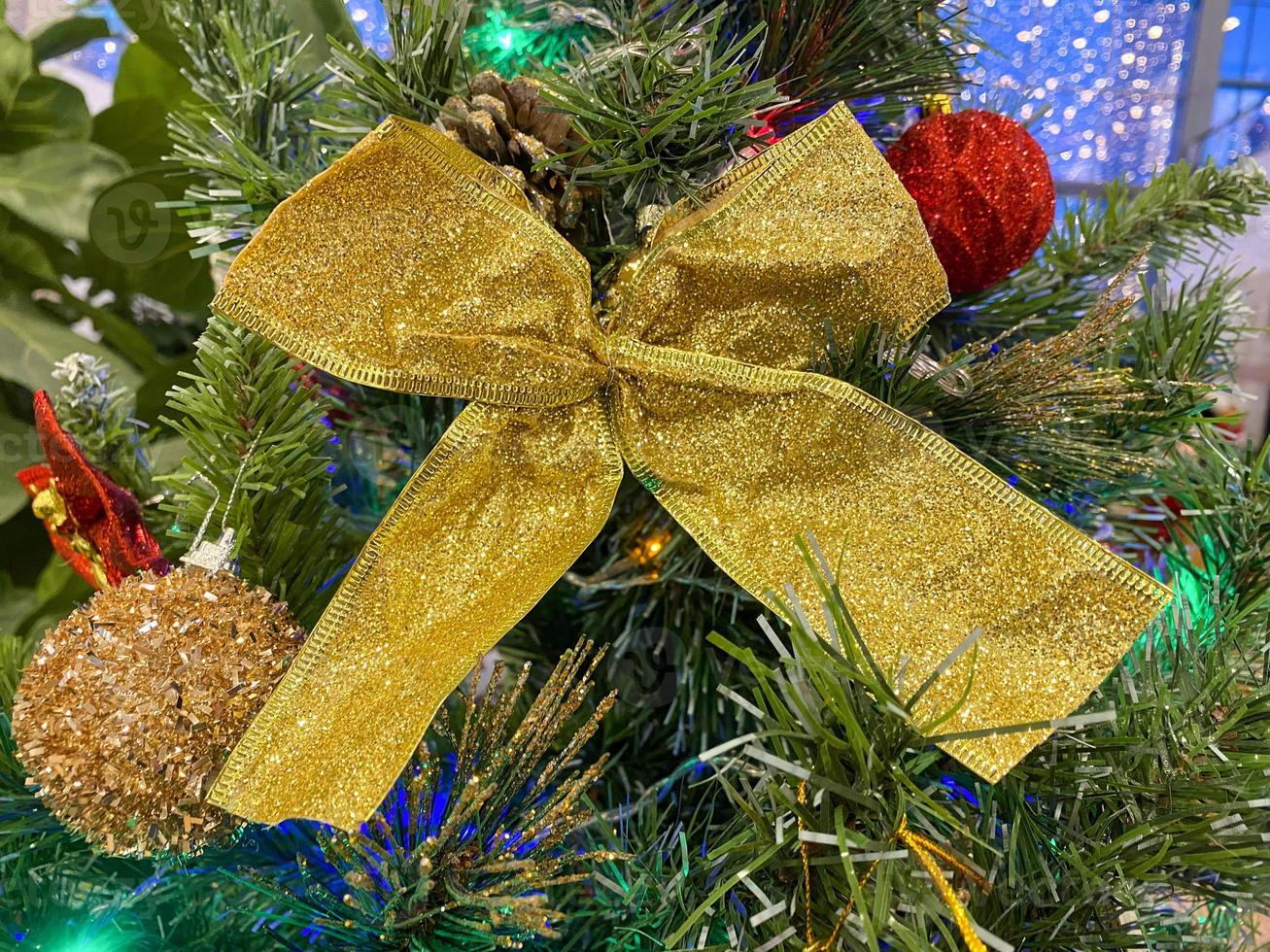 Christmas toy, golden bow. photo