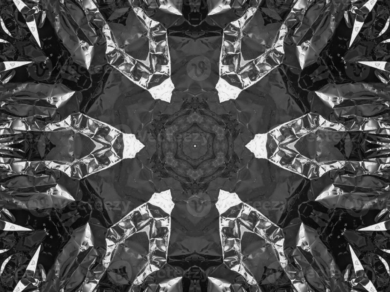 Black silver metalic kaleidoscope background. Abstract and symmetric pattern with dark vibes. photo