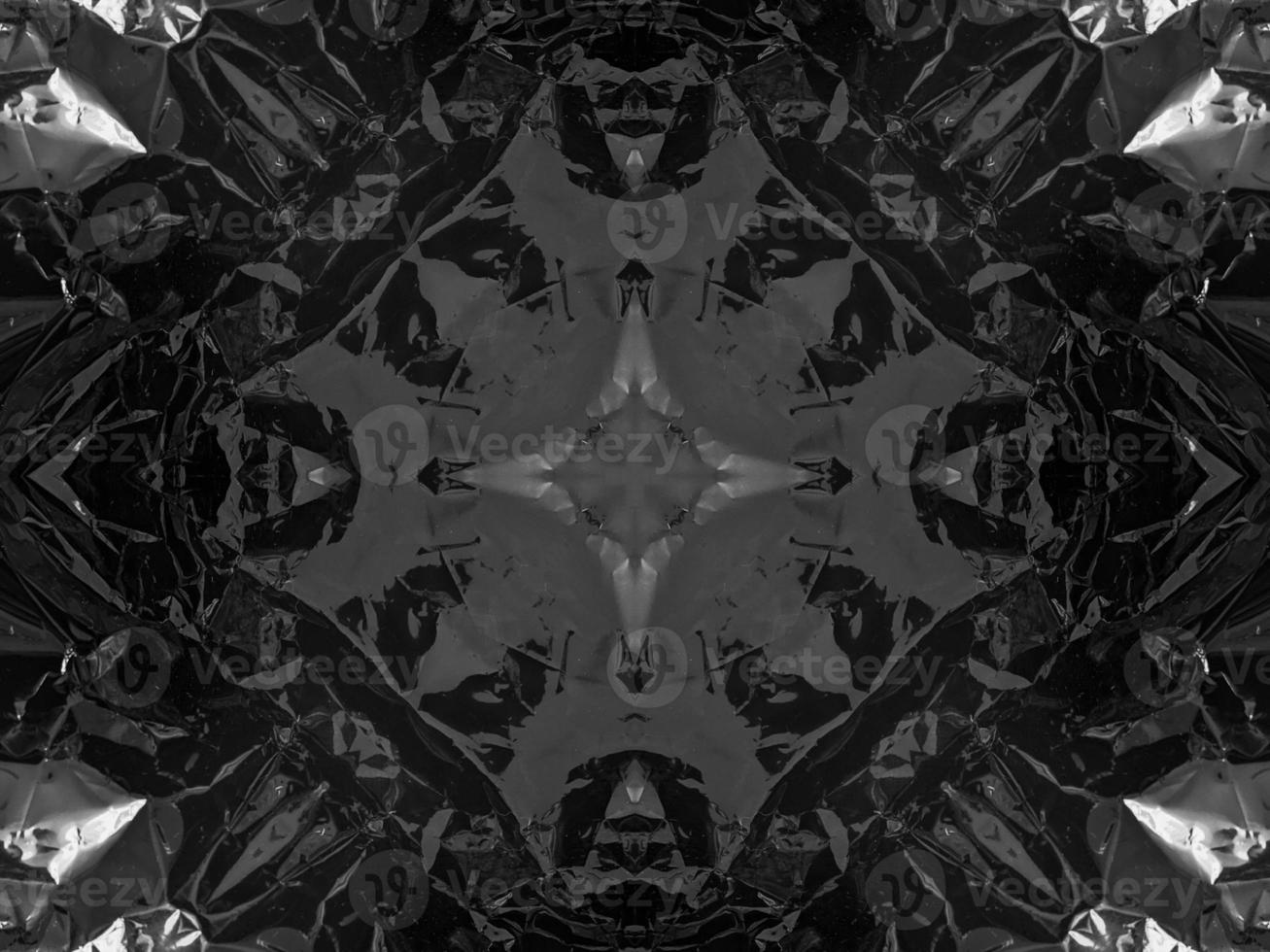 Black silver metalic kaleidoscope background. Abstract and symmetric pattern with dark vibes. photo