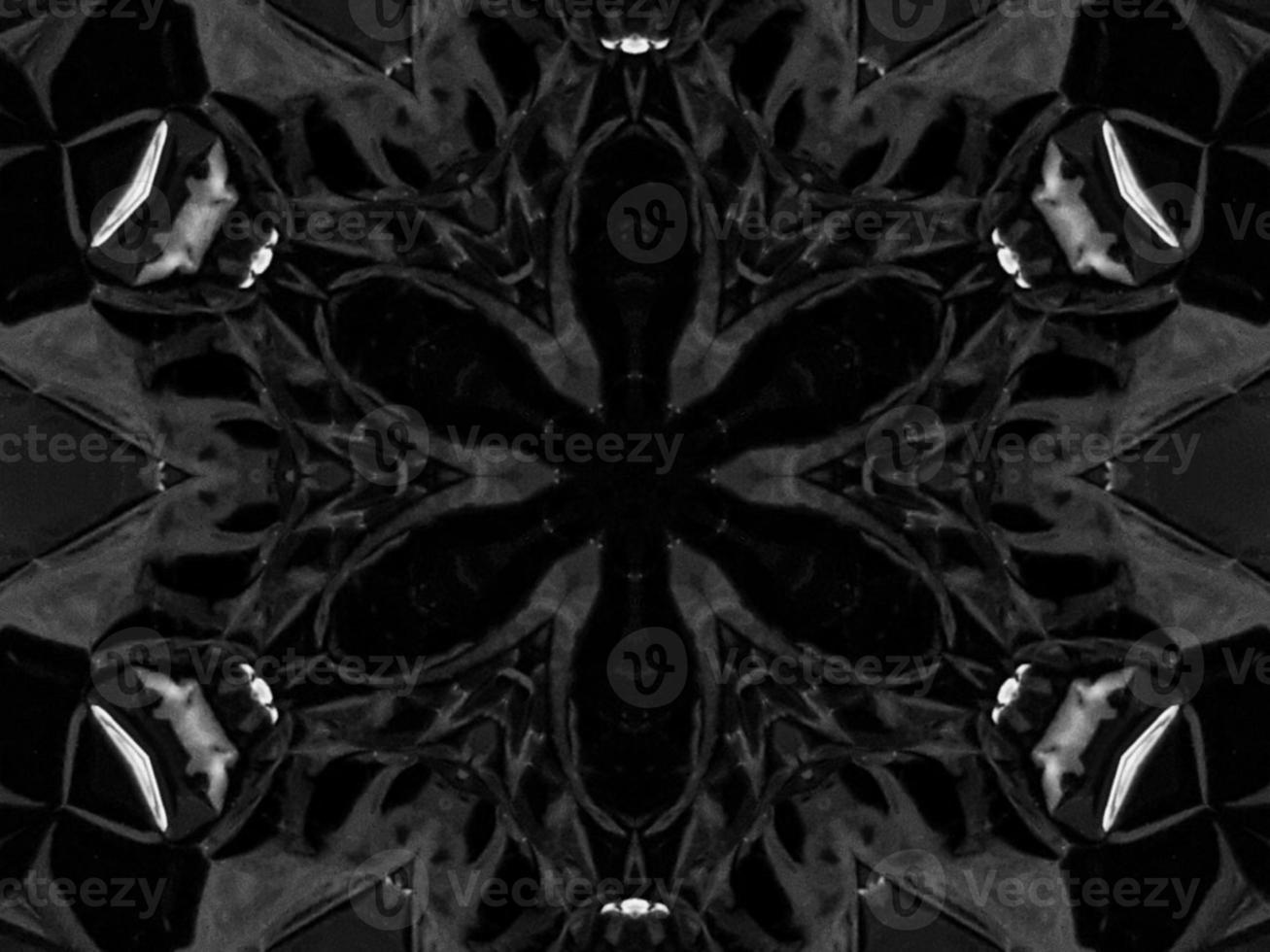 Black silver metalic kaleidoscope background. Abstract and symmetric pattern with dark vibes. photo