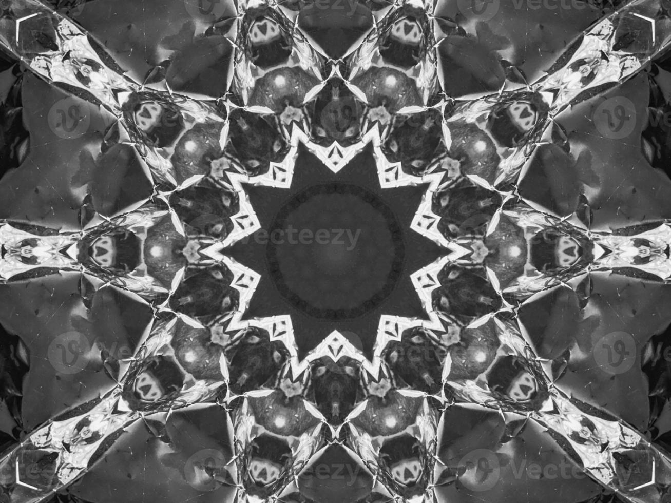 Black silver metalic kaleidoscope background. Abstract and symmetric pattern with dark vibes. photo