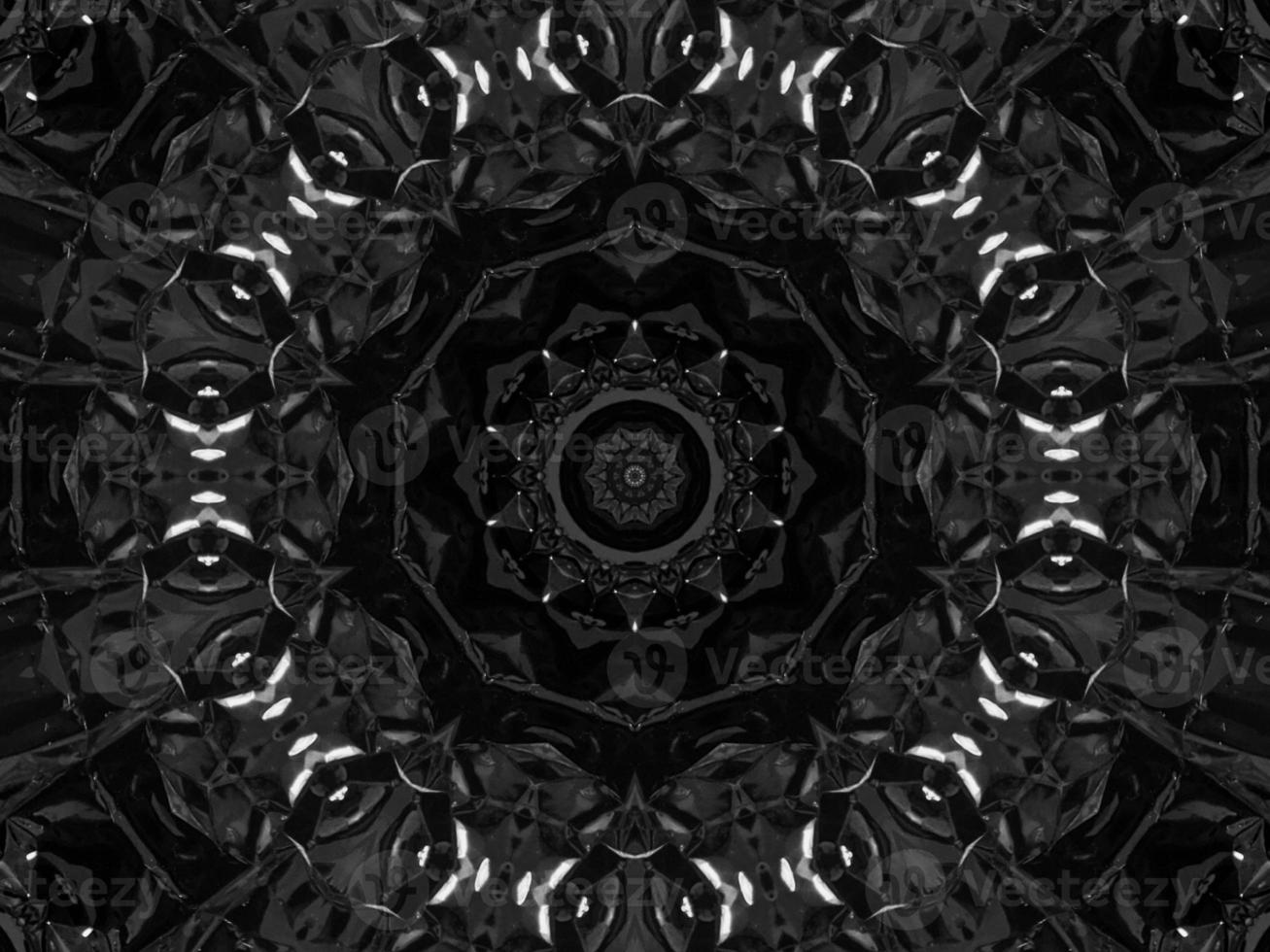 Black silver metalic kaleidoscope background. Abstract and symmetric pattern with dark vibes. photo