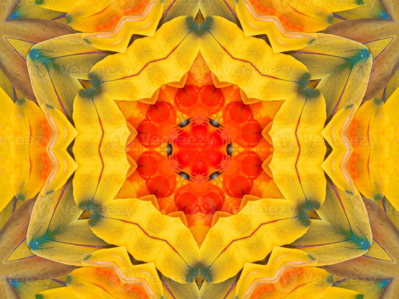 Yellow feather kaleidoscope floral pattern with some blue and red color. Abstract unique and aesthetic background. photo