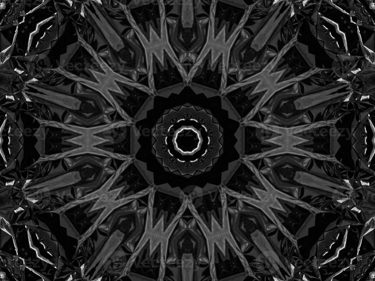 Black silver metalic kaleidoscope background. Abstract and symmetric pattern with dark vibes. photo