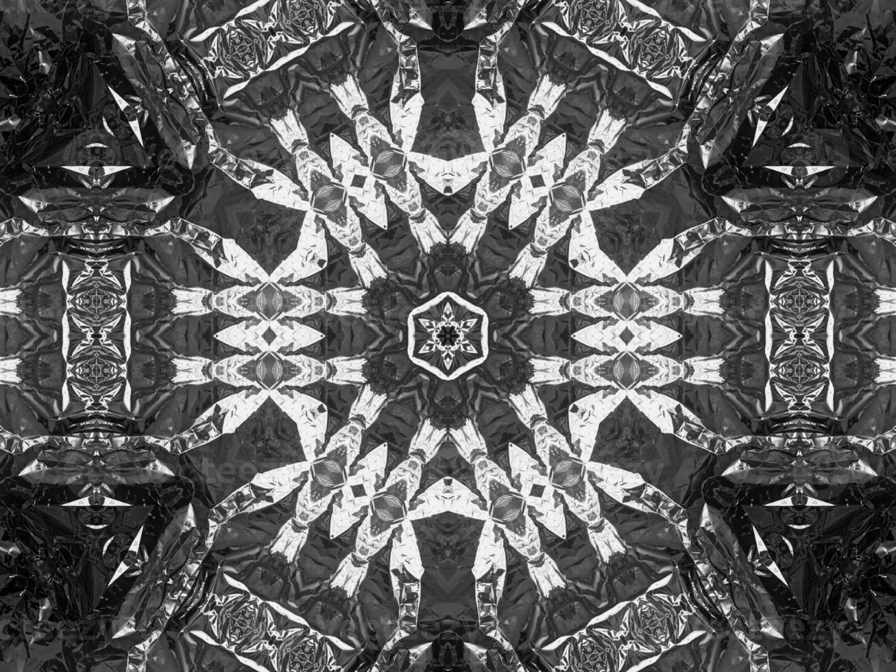 Black silver metalic kaleidoscope background. Abstract and symmetric pattern with dark vibes. photo