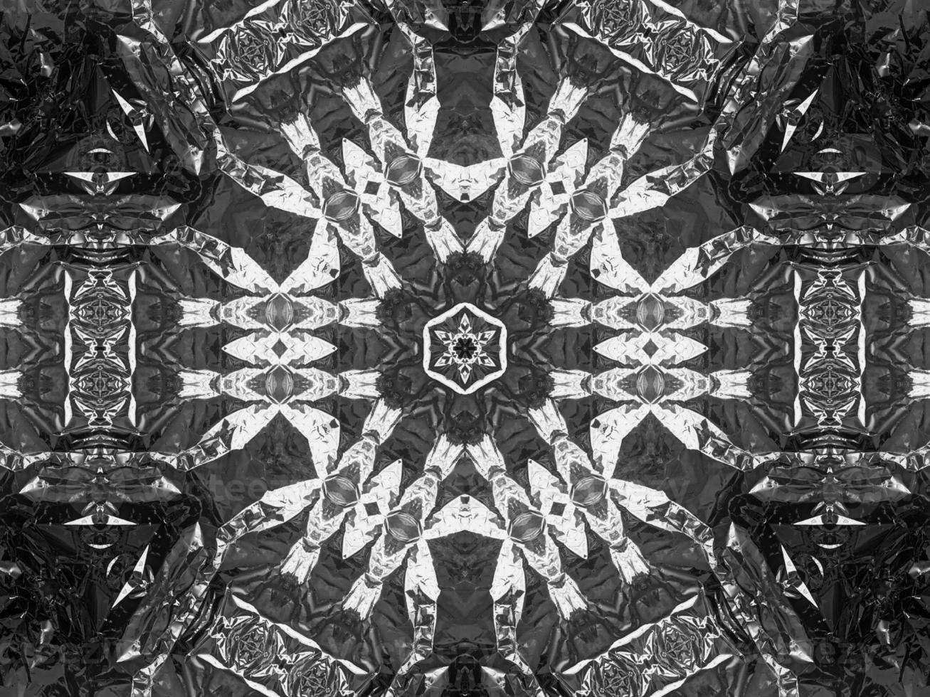 Black silver metalic kaleidoscope background. Abstract and symmetric pattern with dark vibes. photo