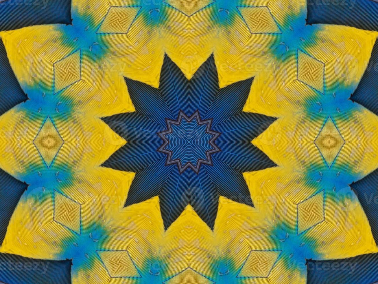 Yellow feather kaleidoscope floral pattern with some blue and red color. Abstract unique and aesthetic background. photo