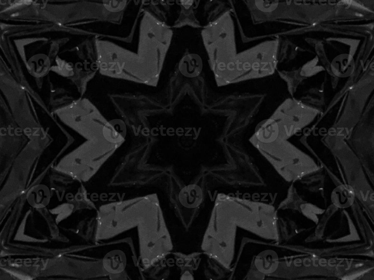 Black silver metalic kaleidoscope background. Abstract and symmetric pattern with dark vibes. photo