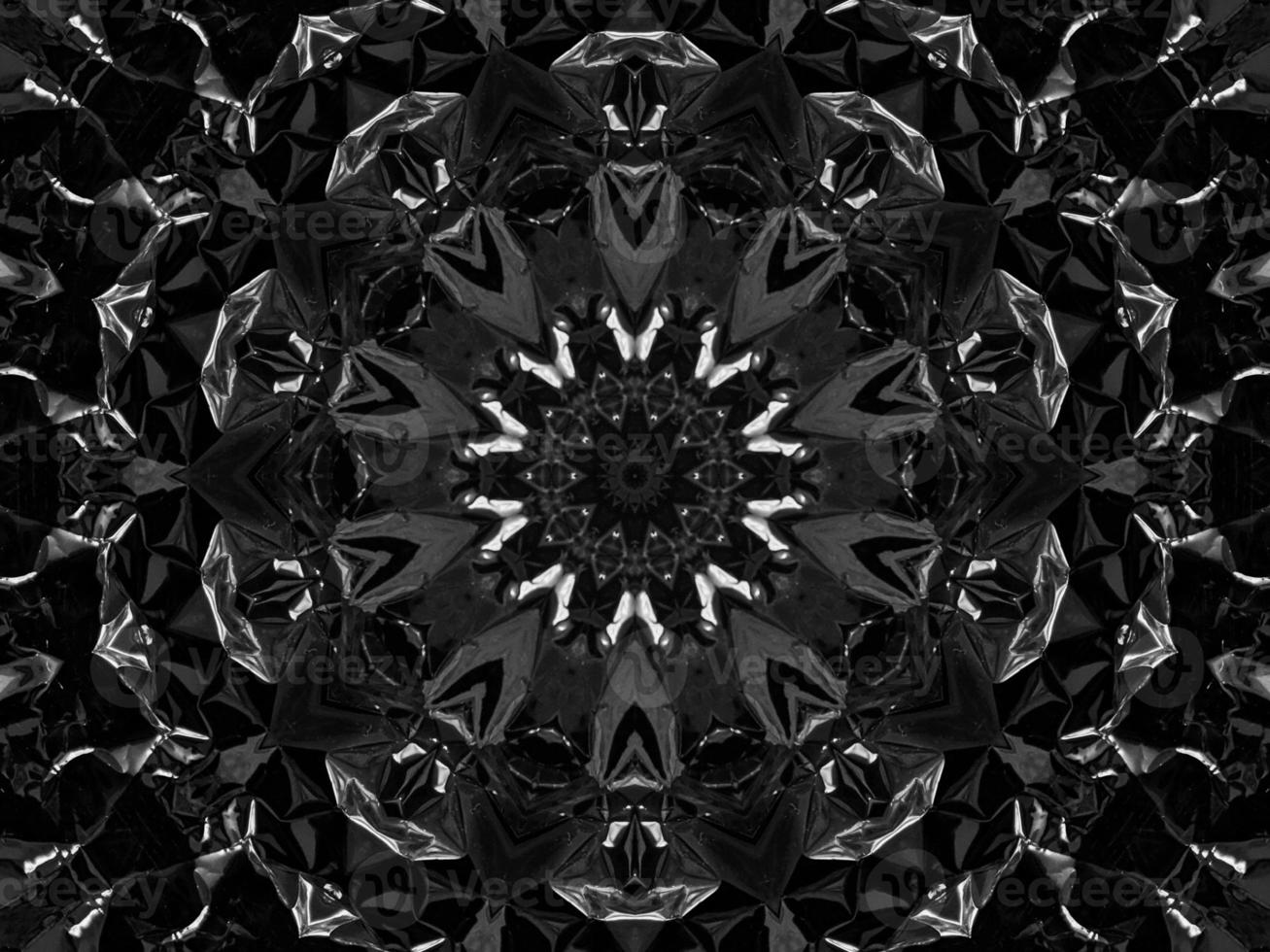 Black silver metalic kaleidoscope background. Abstract and symmetric pattern with dark vibes. photo