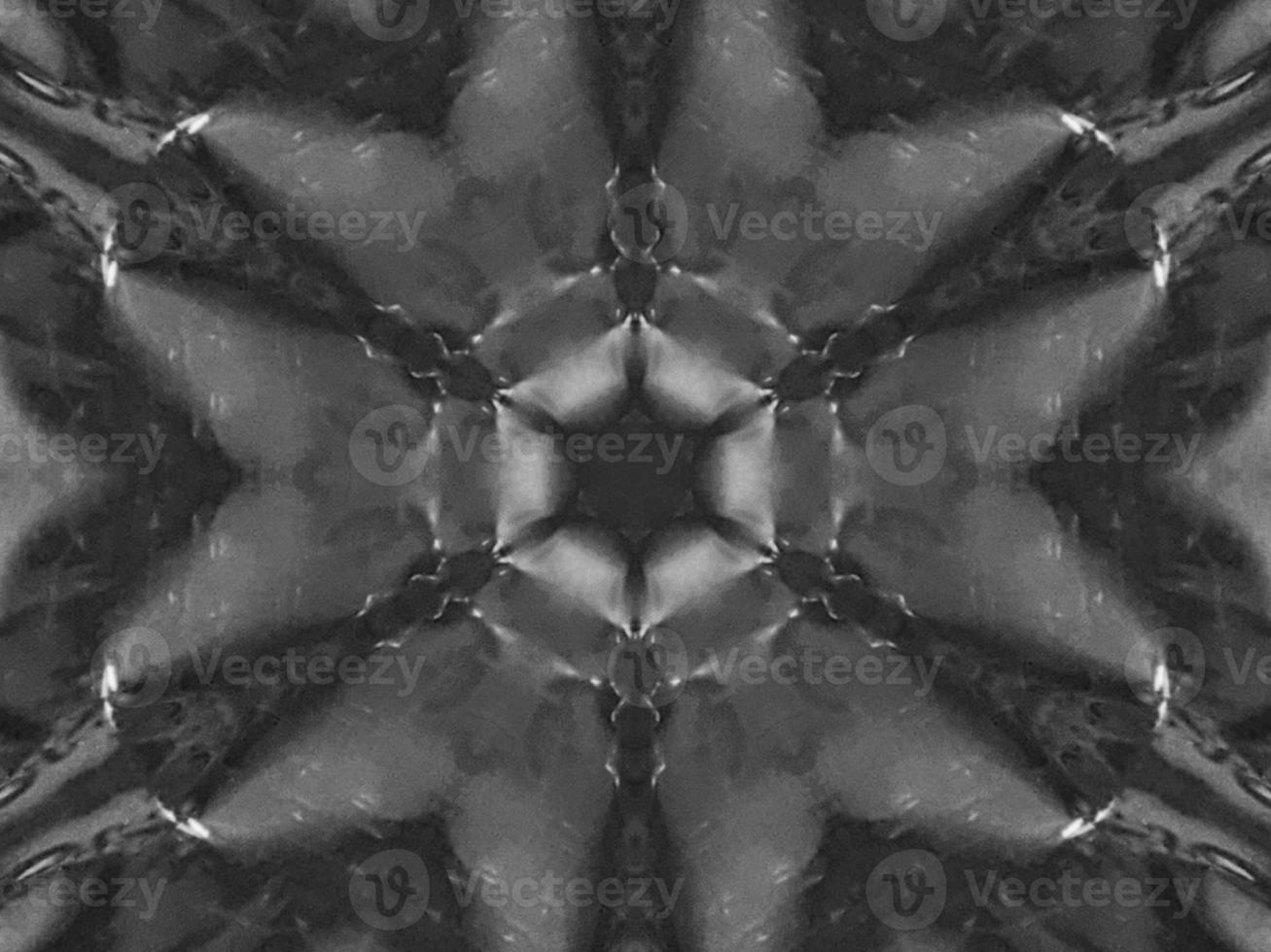 Black silver metalic kaleidoscope background. Abstract and symmetric pattern with dark vibes. photo