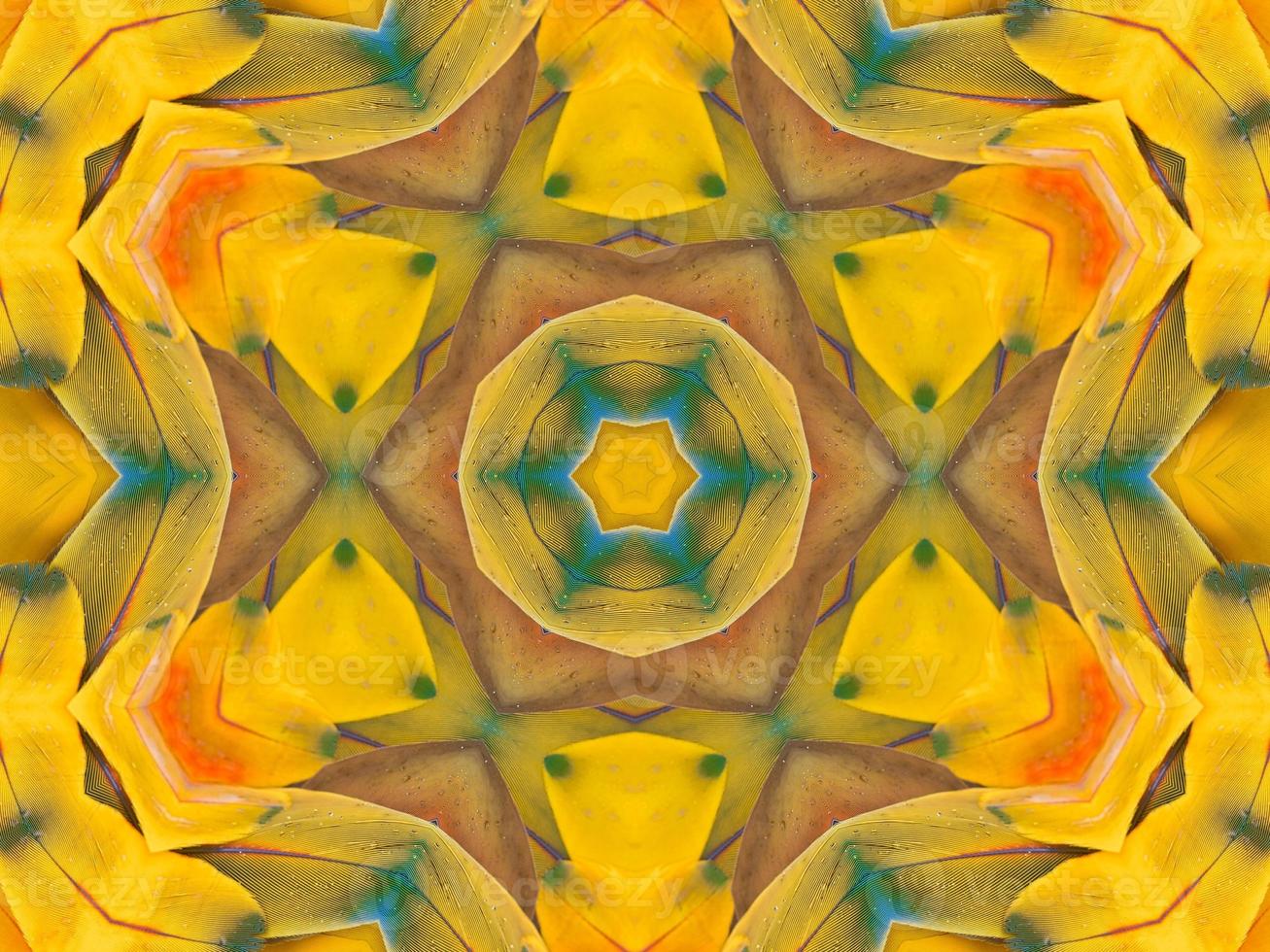 Yellow feather kaleidoscope floral pattern with some blue and red color. Abstract unique and aesthetic background. photo