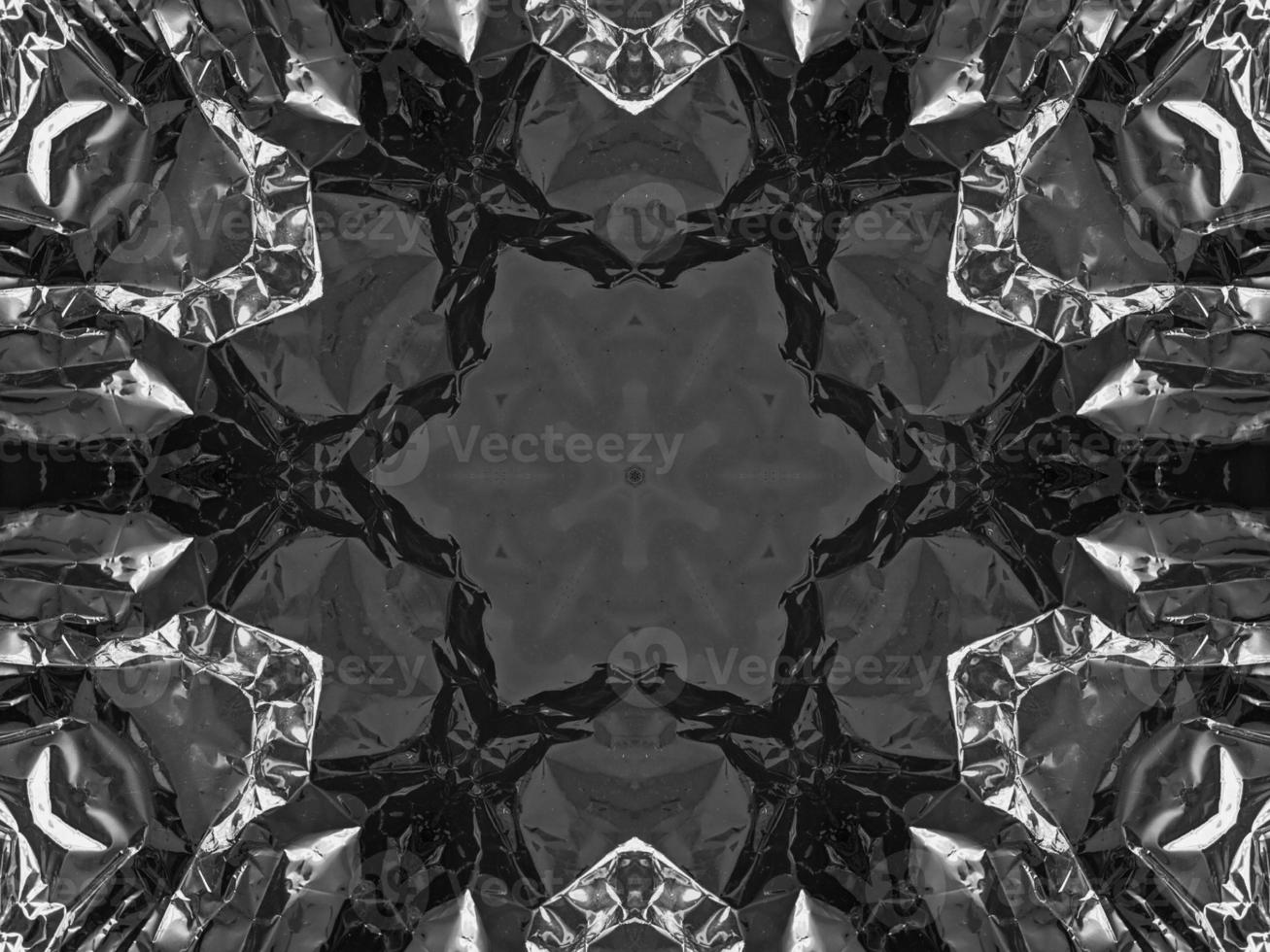 Black silver metalic kaleidoscope background. Abstract and symmetric pattern with dark vibes. photo