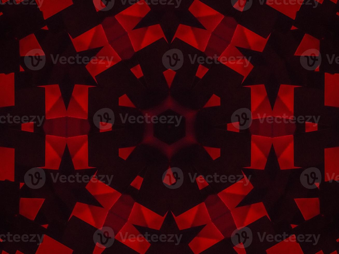 Dark red metallic kaleidoscope background. Abstract and symmetric pattern with horor vibes photo