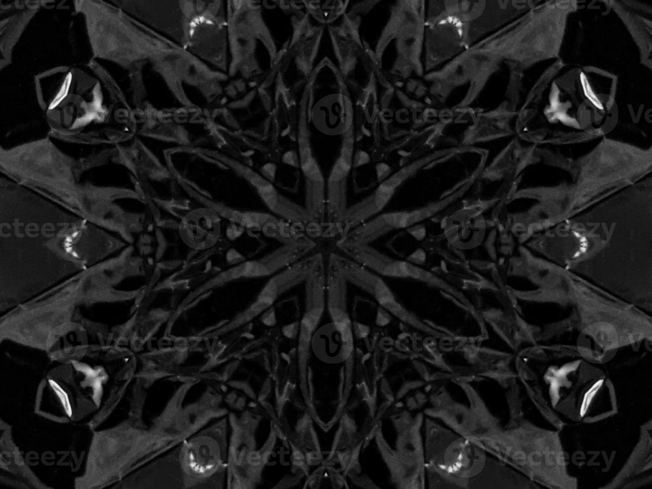 Black silver metalic kaleidoscope background. Abstract and symmetric pattern with dark vibes. photo