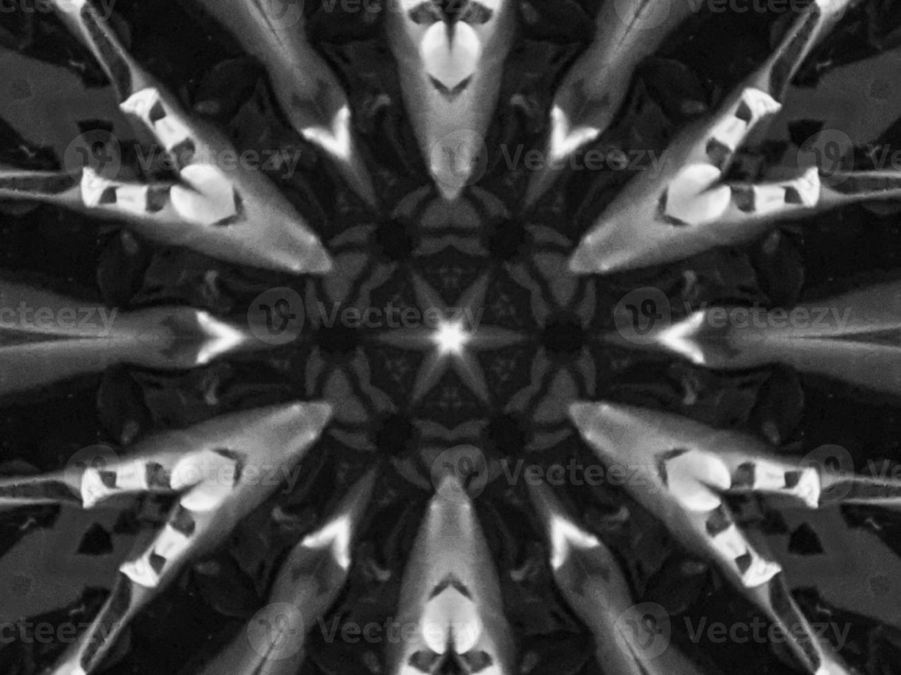 Black silver metalic kaleidoscope background. Abstract and symmetric pattern with dark vibes. photo