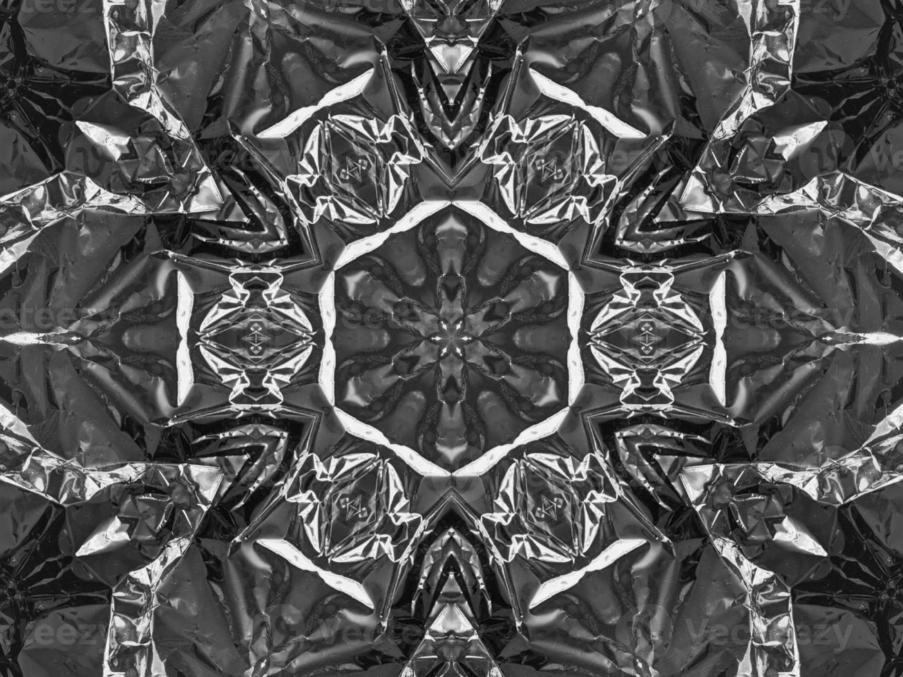 Black silver metalic kaleidoscope background. Abstract and symmetric pattern with dark vibes. photo