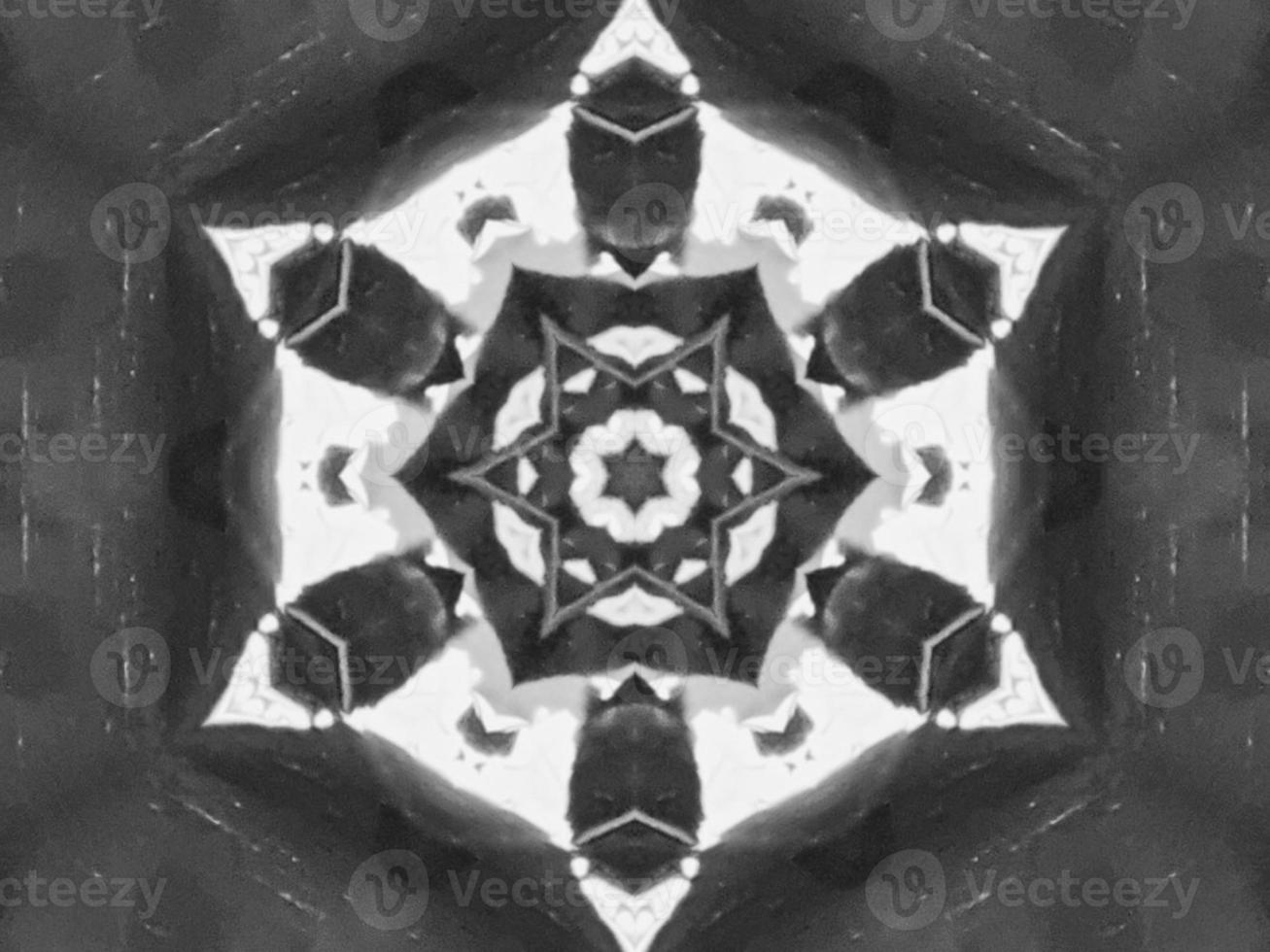 Black silver metalic kaleidoscope background. Abstract and symmetric pattern with dark vibes. photo