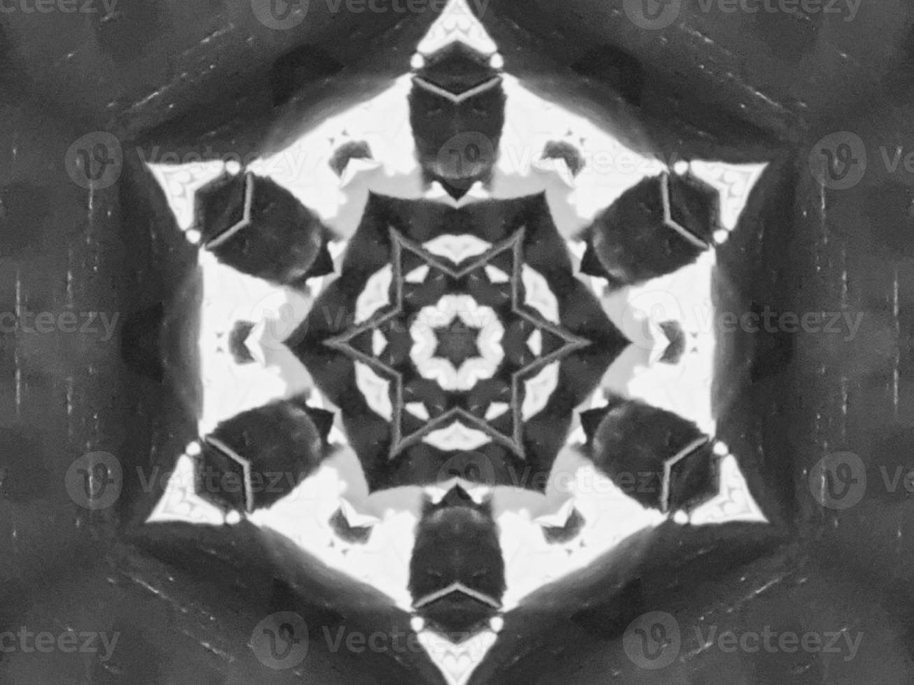 Black silver metalic kaleidoscope background. Abstract and symmetric pattern with dark vibes. photo