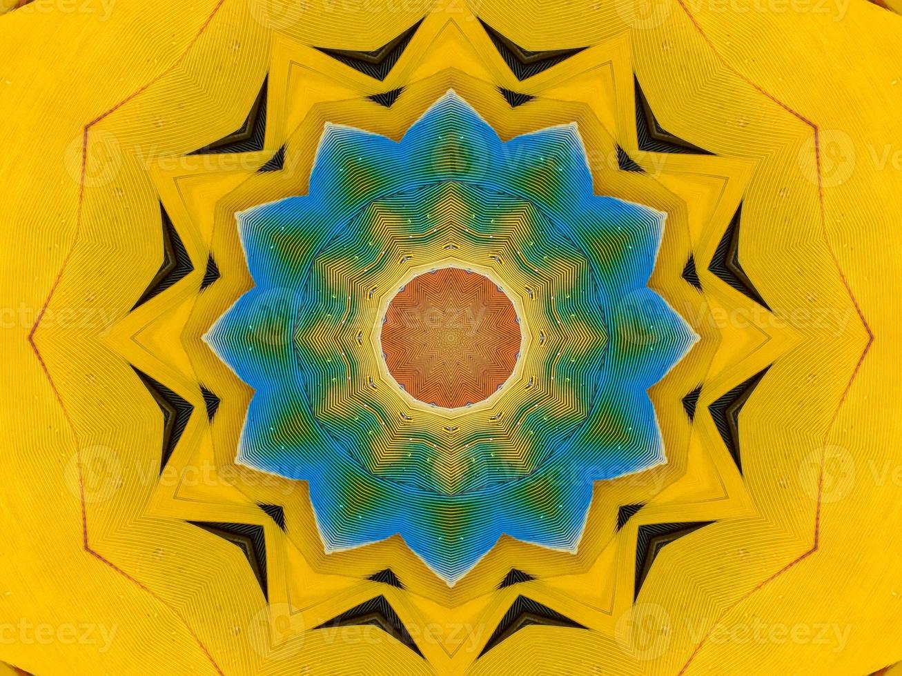 Yellow feather kaleidoscope floral pattern with some blue and red color. Abstract unique and aesthetic background. photo