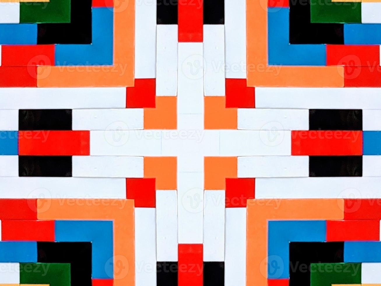A colorful brick kaleidoscope background. Symmetric abstract and aesthetic pattern photo