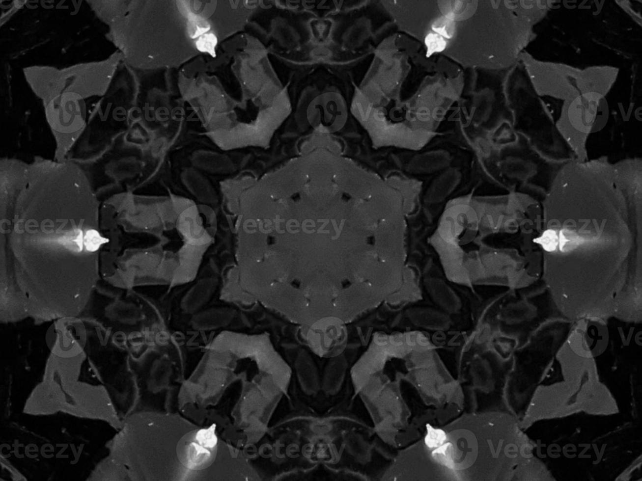 Black silver metalic kaleidoscope background. Abstract and symmetric pattern with dark vibes. photo