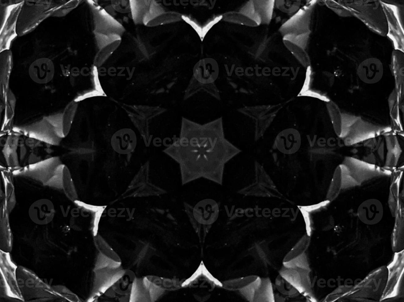 Black silver metalic kaleidoscope background. Abstract and symmetric pattern with dark vibes. photo