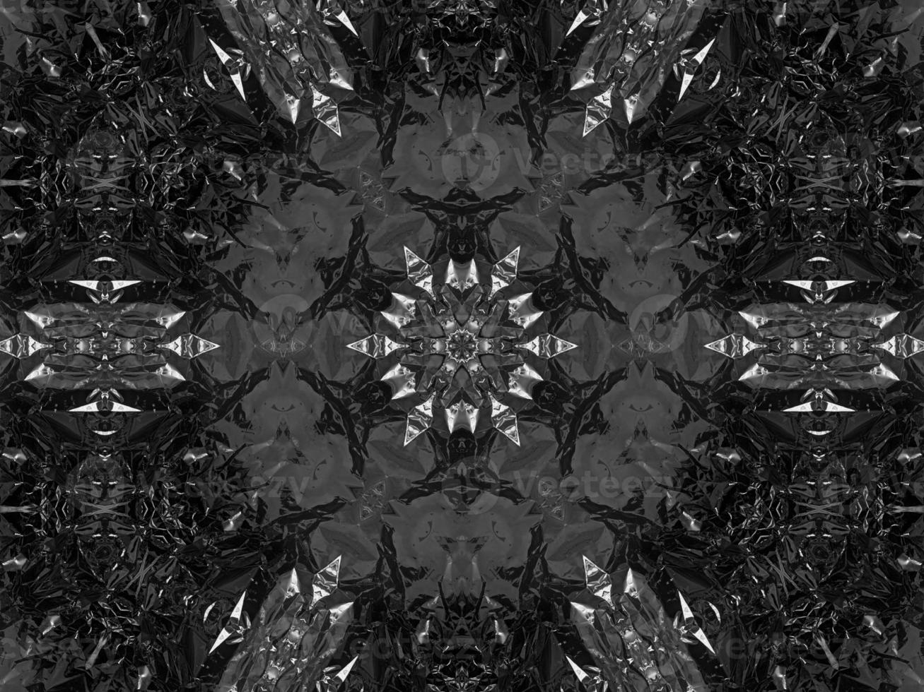 Black silver metalic kaleidoscope background. Abstract and symmetric pattern with dark vibes. photo