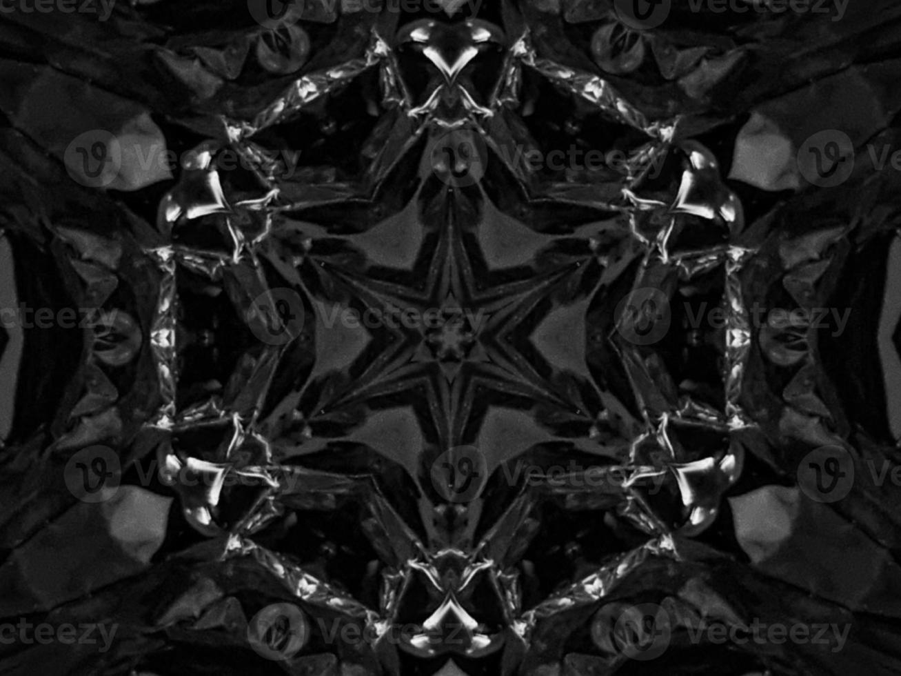 Black silver metalic kaleidoscope background. Abstract and symmetric pattern with dark vibes. photo