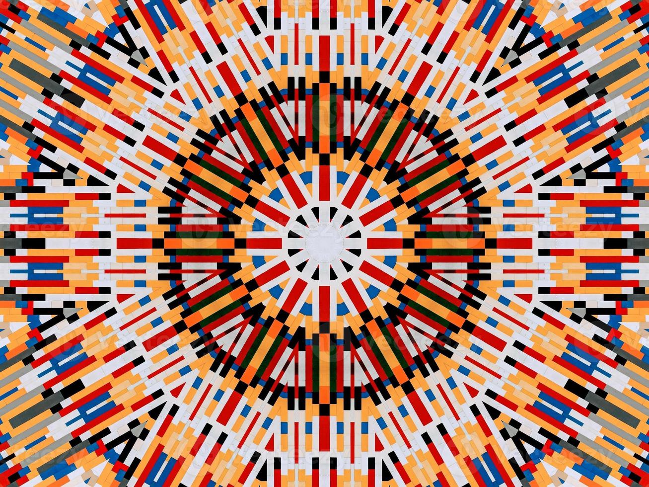 A colorful brick kaleidoscope background. Symmetric abstract and aesthetic pattern photo