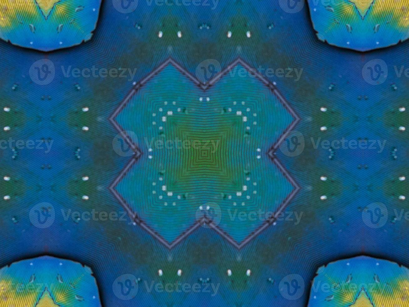 Yellow feather kaleidoscope floral pattern with some blue and red color. Abstract unique and aesthetic background. photo