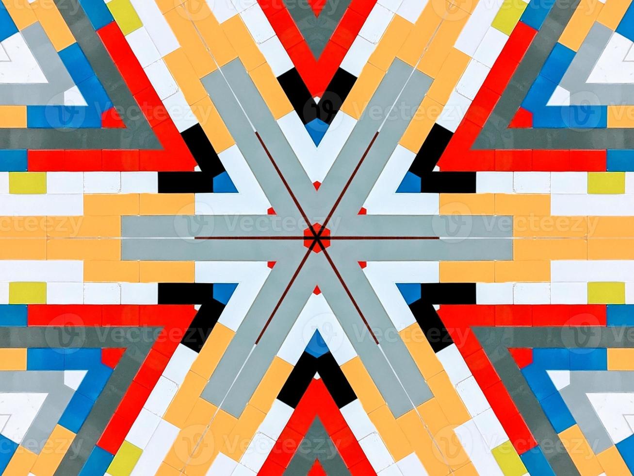 A colorful brick kaleidoscope background. Symmetric abstract and aesthetic pattern photo