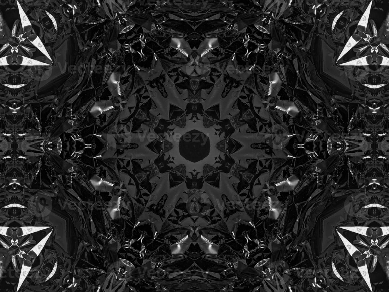 Black silver metalic kaleidoscope background. Abstract and symmetric pattern with dark vibes. photo