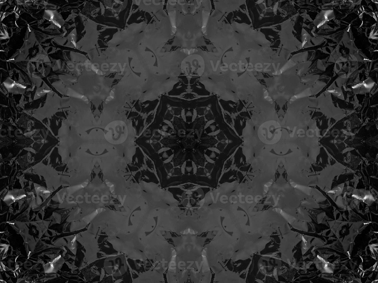 Black silver metalic kaleidoscope background. Abstract and symmetric pattern with dark vibes. photo