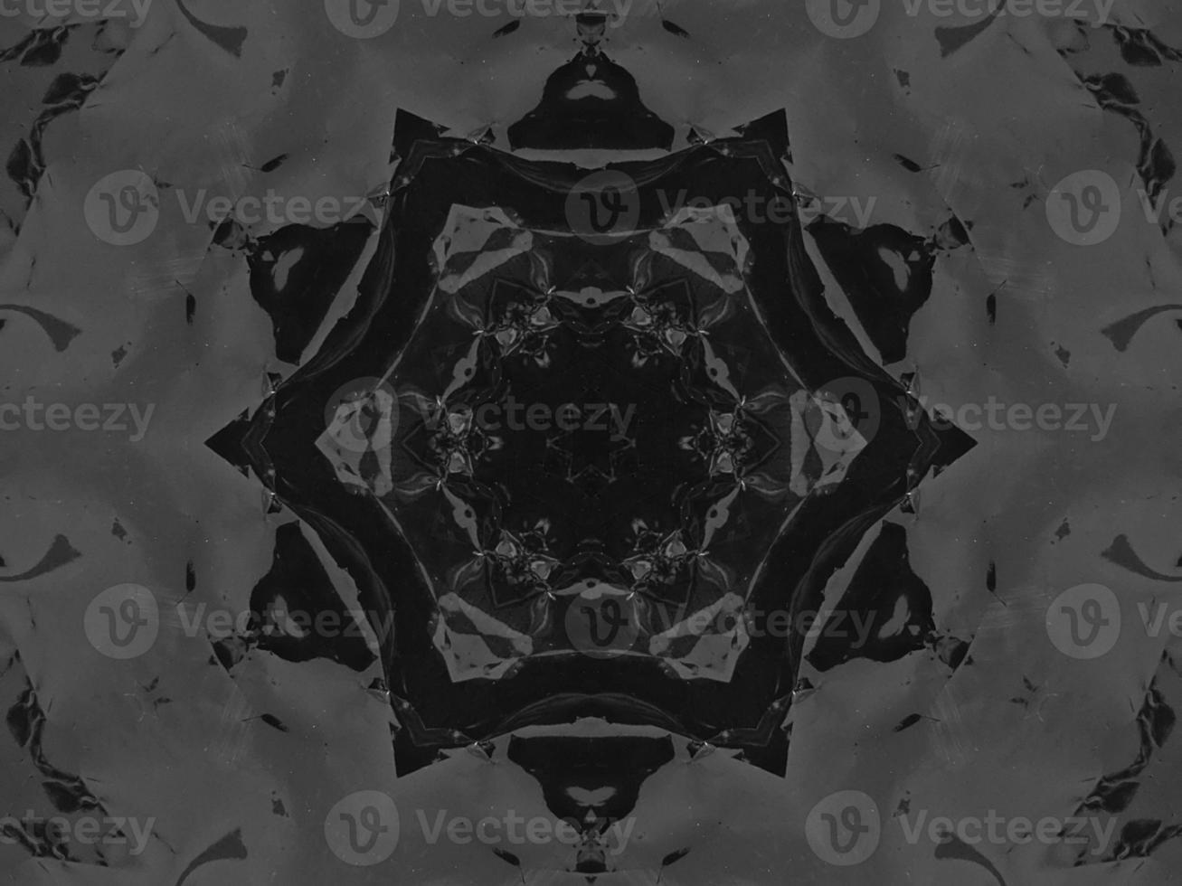 Black silver metalic kaleidoscope background. Abstract and symmetric pattern with dark vibes. photo