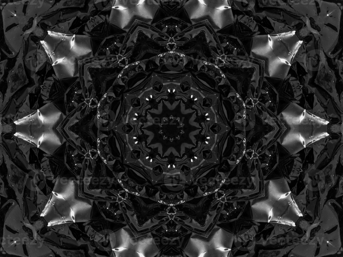 Black silver metalic kaleidoscope background. Abstract and symmetric pattern with dark vibes. photo