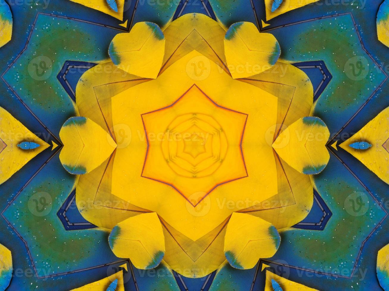 Yellow feather kaleidoscope floral pattern with some blue and red color. Abstract unique and aesthetic background. photo