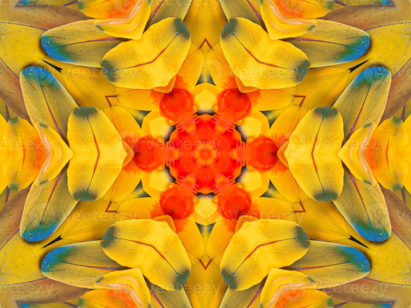Yellow feather kaleidoscope floral pattern with some blue and red color. Abstract unique and aesthetic background. photo