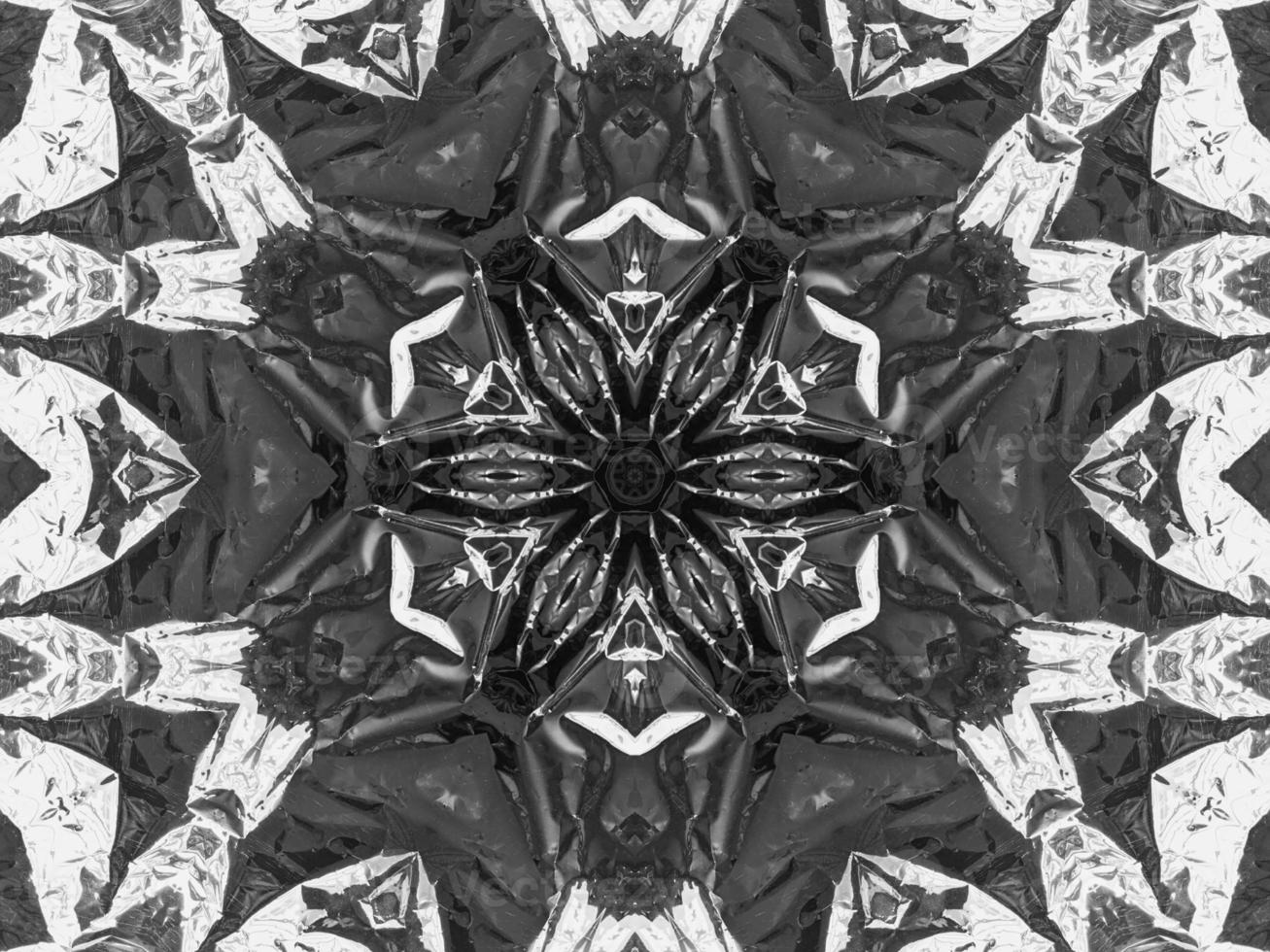 Black silver metalic kaleidoscope background. Abstract and symmetric pattern with dark vibes. photo