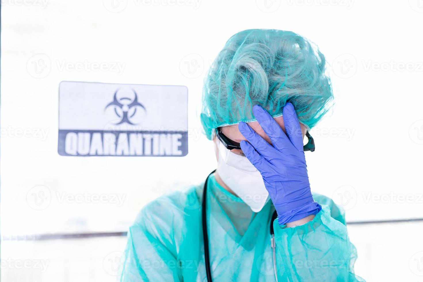 Coronavirus pandemic . Tired exhausted doctor, nurse after long shift fighting against Coronavirus 2019-nCoV at hospital clinic. Global pandemic outbreak SARS-CoV-2 worldwide virus. photo