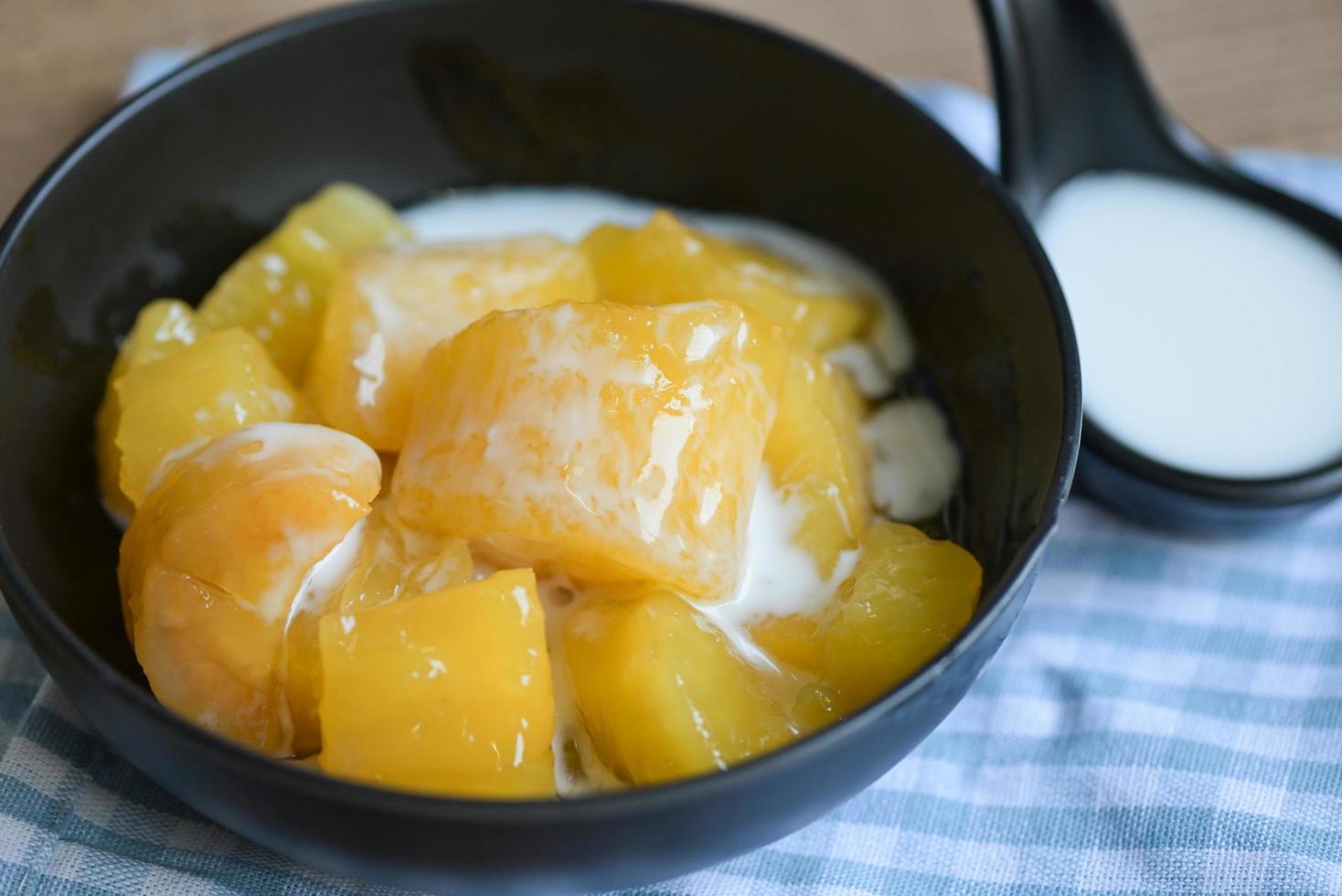 cassava food on the table food, sweet dessert made of boiled cassava, sugar and coconut milik - Thai food photo