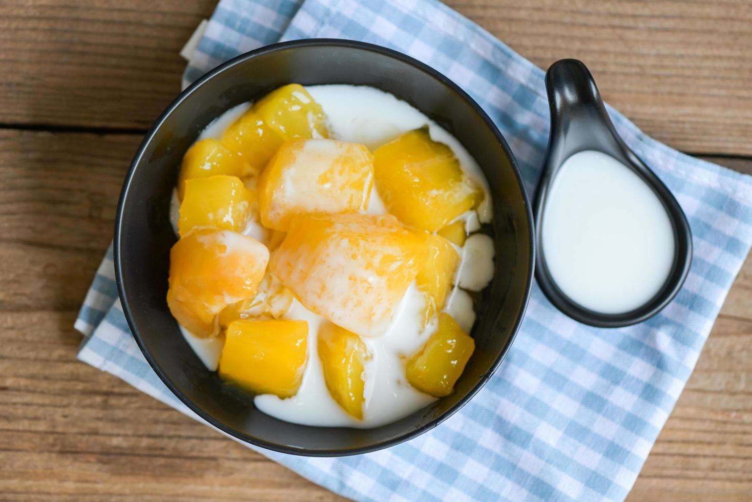 cassava food on the table food, sweet dessert made of boiled cassava, sugar and coconut milik - Thai food photo