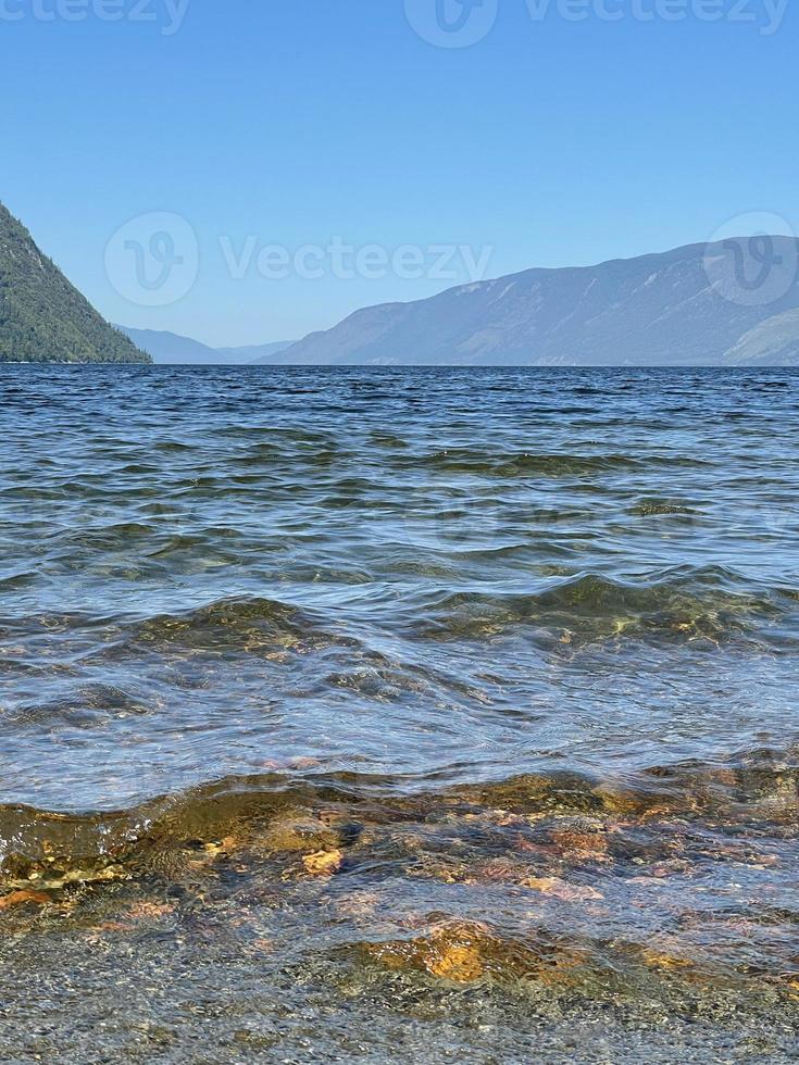 Lake Teletskoye in sunny day. Altai, Russia. photo