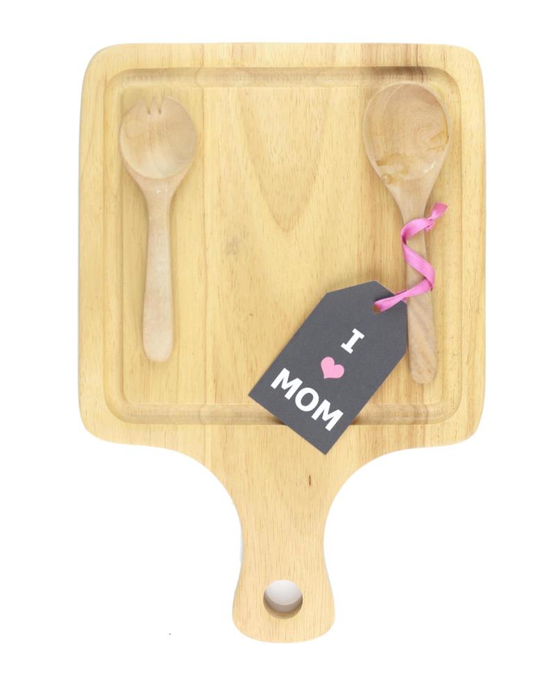 Top view of cutting board with spoon, fork  and i love mom card photo