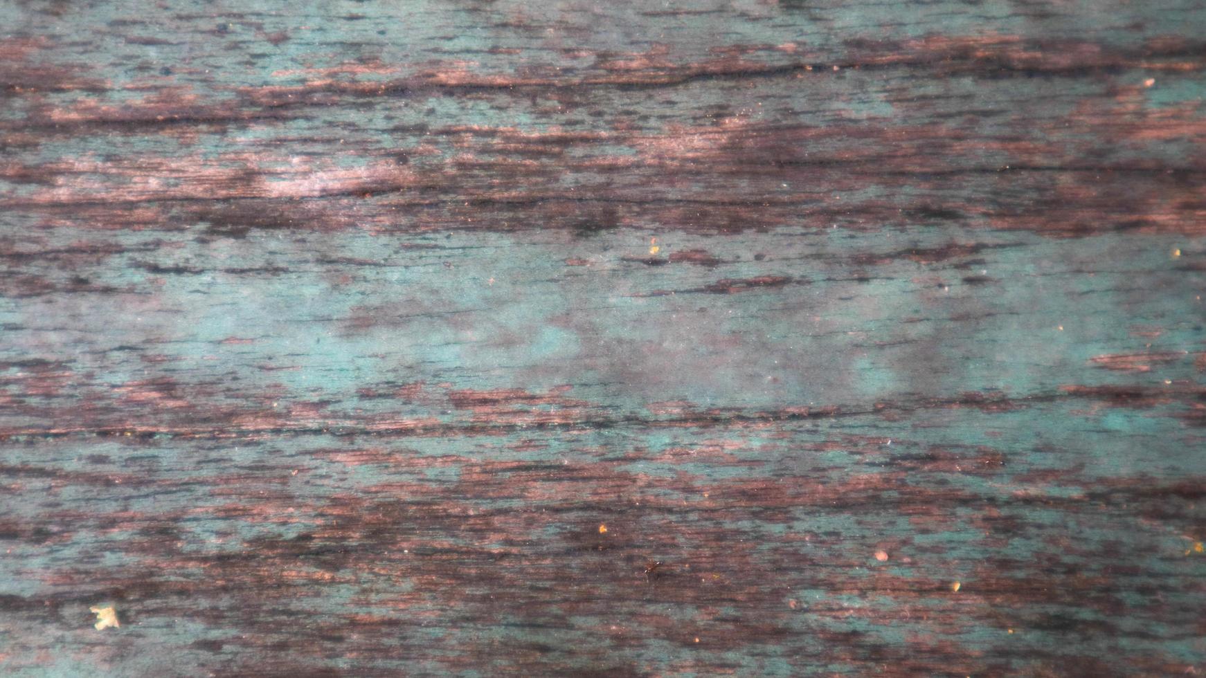 wood texture with faded paint as background photo