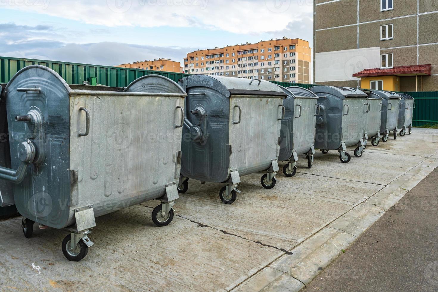 metal trash cans for separate waste collection in a densely populated area of the city photo